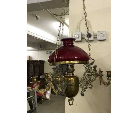 An antique brass hanging oil lamp with chimney and shade 