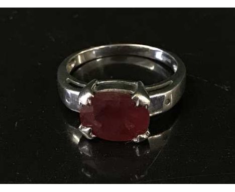 An 18ct white gold ring set with a large ruby 