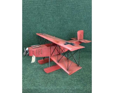A metal model of a bi plane 