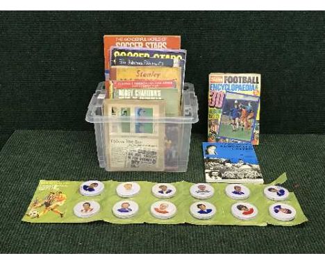 A box of books relating to football and set of Hartleys Footballer Jam jar lids 