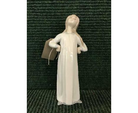 A Lladro figure - girl in night dress 