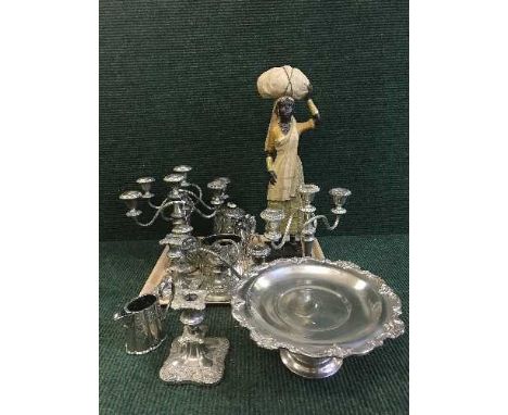 A tray of EPNS to include three piece tea service, candellabra, tazza etc, together with a plaster figure