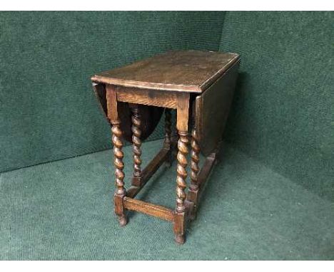 An oak barley twist gate leg table