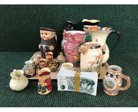 A tray of assorted toby jugs, Art deco jug, money bank etc 