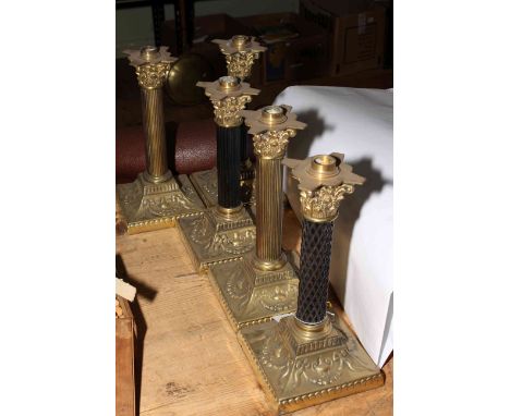 Five brass corinthian column oil lamp bases, 30cm high.