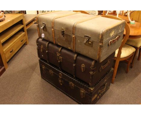 Three vintage cabin trunks.