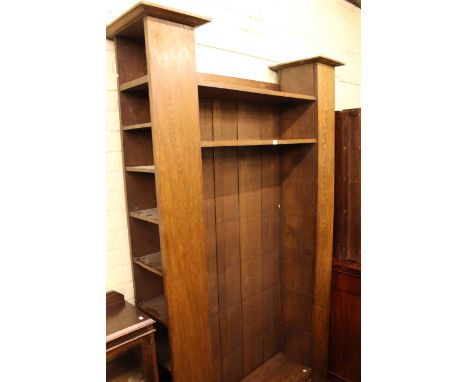 Early 20th Century oak bookcase, the open centre flanked by two opposing open ends, 238cm x 144cm x 40cm (lacking shelf suppo