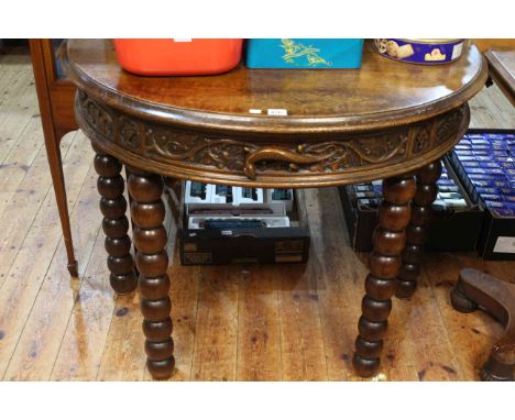 Carved oak single drawer demi-lune console table on bobbin legs, 76.5cm x 95cm x 48cm.