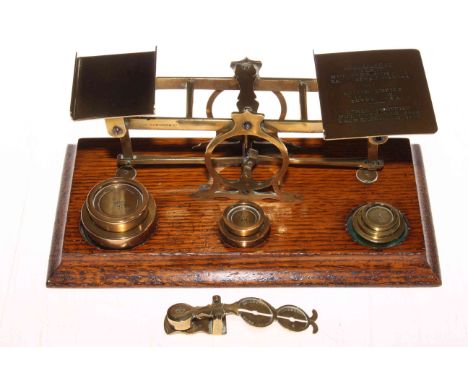 S. Mordan &amp; Co. postal scales with weights, 26cm across, together with sovereign scale (2).