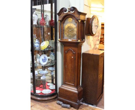 Antique oak 8-day longcase clock having arched brass dial, by Valen Downs, Louth.
