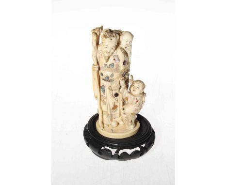 Japanese Shibayama ivory okimono of elder with children, signed, 14.5cm, with stand.