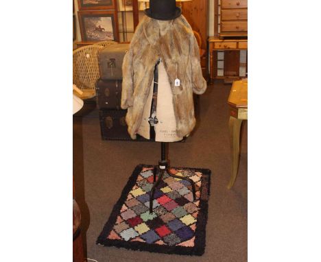 Vintage dress maker's dummy, fur coat, bowler hat, clippy rug, quilt and bed covers.