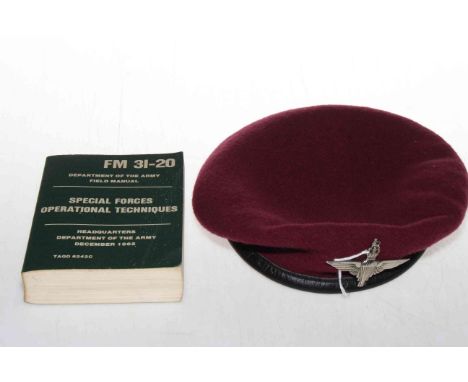 Parachute Regiment cap and Special Forces Operational Techniques manual.