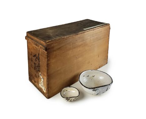 A  set of Japanese ceramic bowls and sauce dish  set with dark rims and soft organic form . Box  included. ( Broken) H: 3 in 