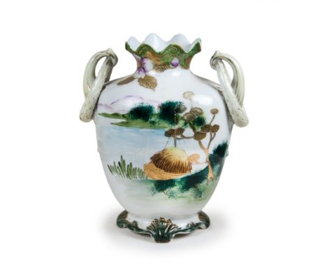 This Japanese vase is painted with a landscape  view on the body, with gilt leaf patterns and has  a pomegranate-shaped mouth