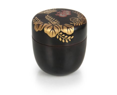A small lacquer tea caddy, the lid with gilt  patterns of wisteria and blossoms. H:2 1/4in(5.7cm)  2 1/8in(5.4cm)