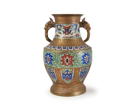 Chinese cloisonne jar with two decorative elephant  handles, densely designed with scroll flower  forms. H:11 3/4in(29.8cm) W