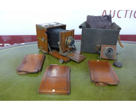 A Victorian plate camera with additional lens and canvas covered box