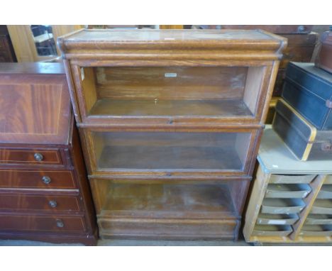 A Globe Wernicke oak three tier stacking sectional bookcase