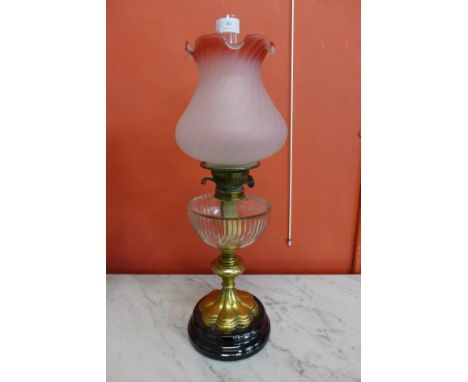 A Victorian brass and glass oil lamp