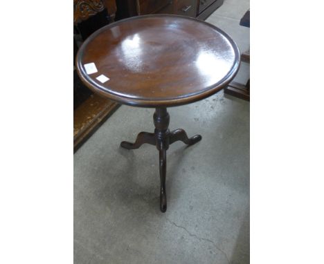 A mahogany tripod wine table