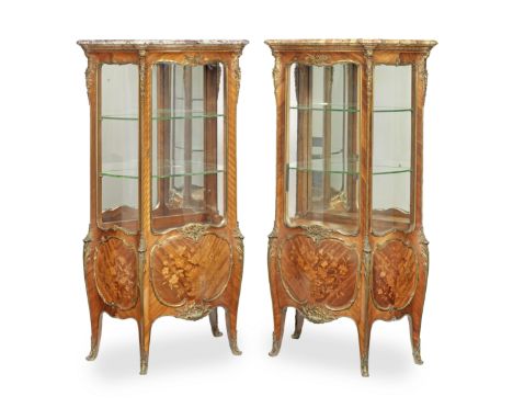 A pair of French late 19th century ormolu mounted kingwood, bois satine and marquetry bombe serpentine vitrinesprobably by Fr