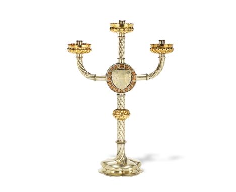 Augustus Welby Northmore Pugin (British, 1812-1852): A rare silvered and gilt plated brass and copper three light candelabrum