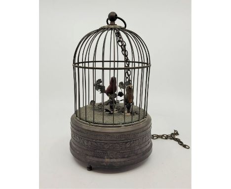 An early 20th century French singing bird automaton, having two song birds with moving beaks, tails and heads, decorated with