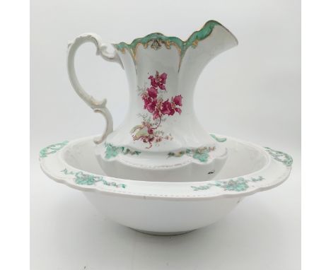 A W.H. Grindley &amp; Co. and C.W.S. Longton dual-marked porcelain jug and wash basin with flowers and ribbon decoration. Som