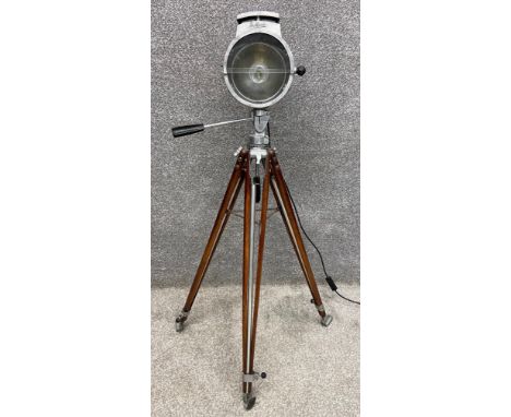 An early to mid 20th century industrial Bullfinch light on adjustable teak tripod supports. H.113cm.