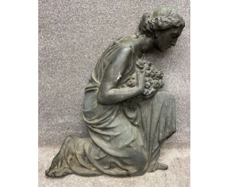 A large late 19th/early 20th century Art Nouveau cast bronze applique depicting a kneeling woman with a bouquet of flowers in