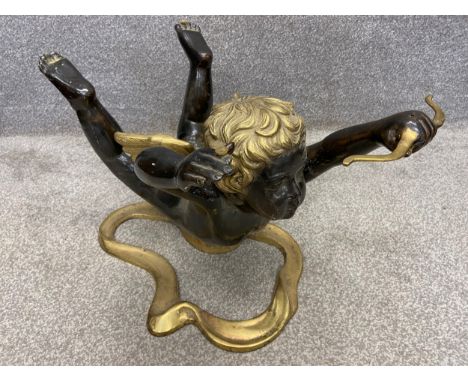 A mid-century Italian cast, patinated and gilt bronze coffee table base depicting Cupid in flight loosing an arrow. (Missing 