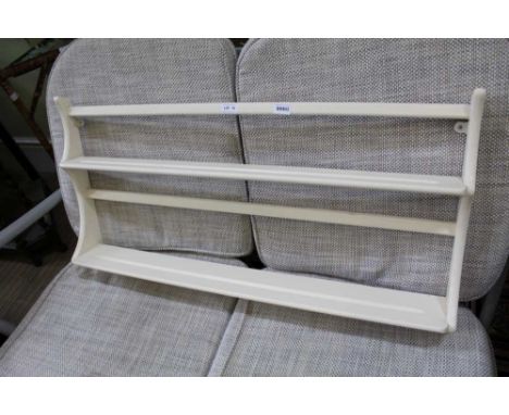 A LATE PAINTED ERCOL SET OF WALL HANGING SHELVES 