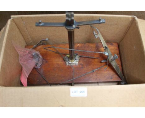 A BOX CONTAINING A PAIR OF MAHOGANY BASED CHEMICAL BALANCE SCALES with a small selection of weights 