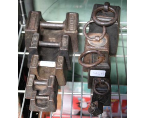 A SERIES OF METAL RING WEIGHTS together with a series of hand weights 