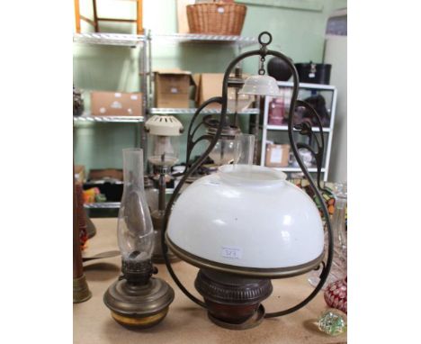 TWO METAL BASED OIL LAMPS, one in ceiling suspension ring, with milk glass shade and ceramic soot catcher 