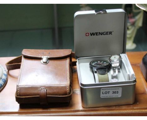 A BOXED WENGER SWISS MADE GENTLEMEN'S WRISTWATCH together with a Swatch watch, on silvered bracelet strap and a vintage cased
