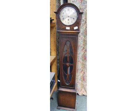 A MID-CENTURY OAK CASED GRANDMOTHER CLOCK with decorative applied beadwork, having glazed aperture and display chromed pendul