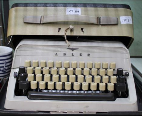 A RETRO DESIGN CASED MANUAL TYPEWRITER by 'Adler' 