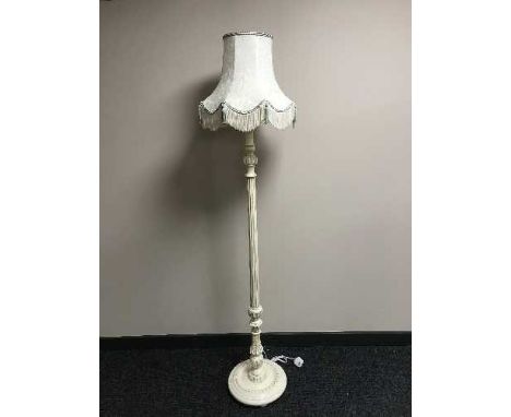 A cream column standard lamp and shade 