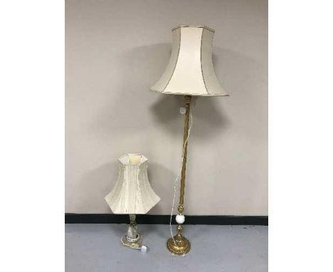 A brass and onyx standard lamp with shade and an onyx table lamp and shade 