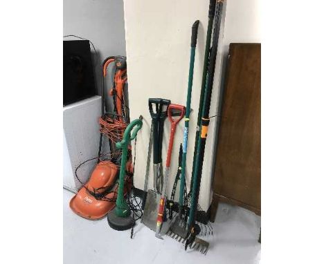 A bundle of garden tools, a Flymo mower and two garden strimmers 