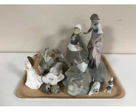 A tray of Lladro and Nao figures (damages), Swarovski hedgehog and a Royal Doulton figure 