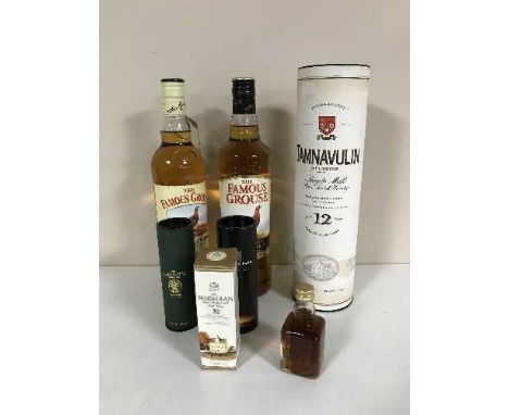 Two x 70 cl bottles of Famous Grouse Scotch Whisky, a bottle of 70cl Tamnavulin 12 year single malt Scotch whisky and four wh