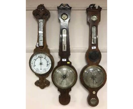 A Victorian inlaid mahogany barometer