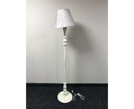 A cream column standard lamp and shade 