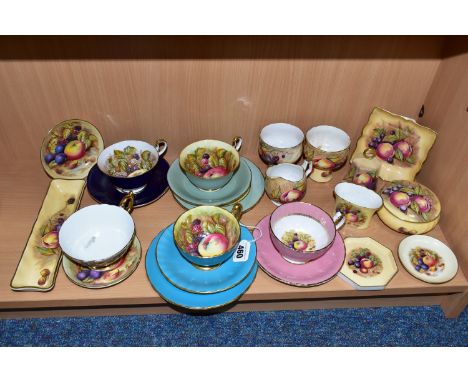 TWENTY THREE PIECES OF AYNSLEY ORCHARD GOLD TEA AND GIFT WARES, to include five teacups and four saucers of different designs