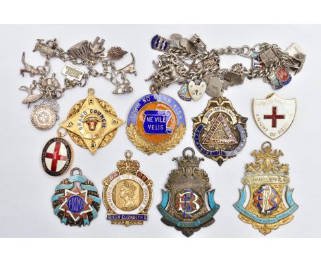 A SELECTION OF MAINLY SILVER ENAMEL MASONIC MEDALS AND TWO WHITE METAL CHARM BRACELETS, to include seven silver enamel medals