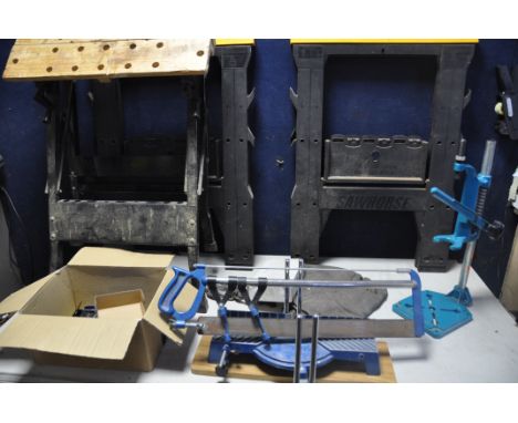 A PAIR OF COMPACT SAWHORSES along with a unbranded folding workbench, Black and Decker drill press attatcment, mitre saw etc