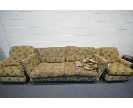A THREE PIECE LOUNGE SUITE, comprising a three seater sofa with floral upholstery, length 224cm, and a pair of armchairs (con